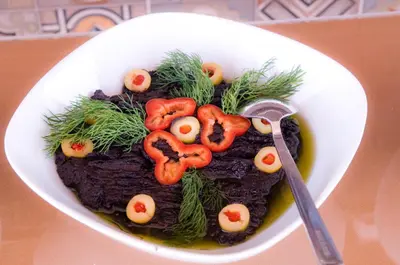 a bowl of food with tomatoes on top of it at Kerimbey Hotel in Gemlik