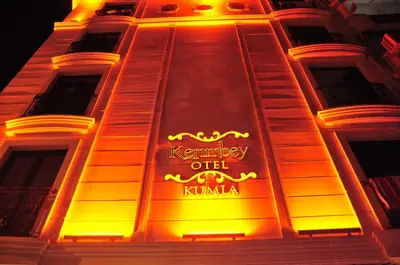 a lit up sign on the side of a building at Kerimbey Hotel in Gemlik