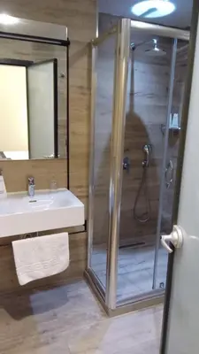 a bathroom with a shower and a sink at Sultanahmet Newport Hotel in Istanbul