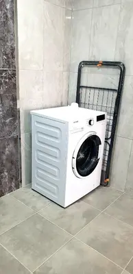 a washing machine sitting on the floor in a room at فلل التن تاج ALTINTAC villalari in Sapanca