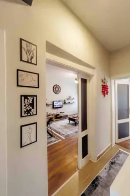 a room with a hallway with a living room at Cihangir House in Istanbul