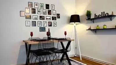 a room with a desk with chairs and a lamp at Cihangir House in Istanbul