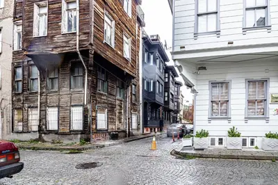 an old wooden building on the side of a street at Deluxe Double Room 4 in Istanbul