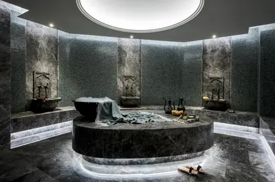 a room with a large tub in the middle at Princes' Palace Resort, Buyukada - Member of The Leading Hotels of the World in Adalar