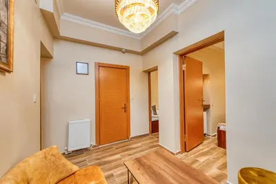 a living room with a coffered ceiling and wooden floors at Brown 2 Mansion Oldcity in Istanbul