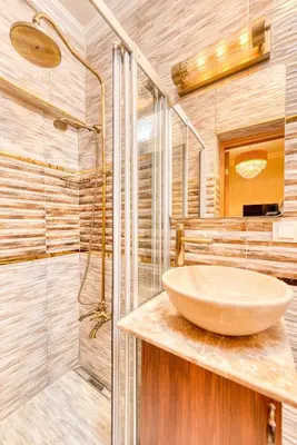 a bathroom with a sink and a shower at Brown 2 Mansion Oldcity in Istanbul