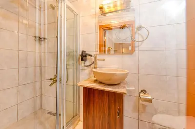 a bathroom with a sink and a shower at Brown 2 Mansion Oldcity in Istanbul