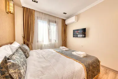 a hotel room with a bed and a window at Brown 2 Mansion Oldcity in Istanbul