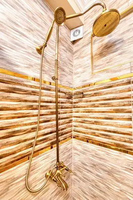 a shower with a shower head in a bathroom at Brown 2 Mansion Oldcity in Istanbul