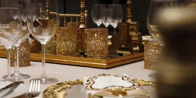 a table with wine glasses and a plate of food at Crowne Plaza Istanbul Oryapark by IHG in Istanbul