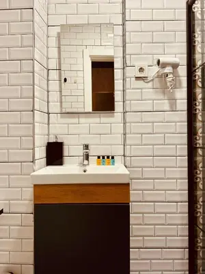a bathroom with a sink and a mirror at THE BEYBÛN HOTEL İstiklal Street Taksim in Istanbul