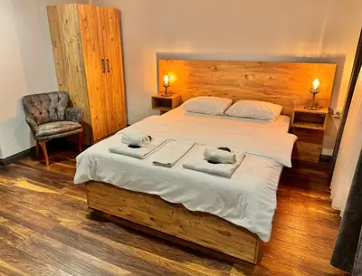 a bedroom with a large bed with two towels on it at Otel Kadıköy in Istanbul