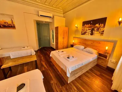 a bedroom with two beds in a room at Otel Kadıköy in Istanbul