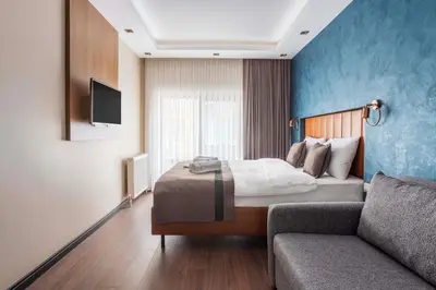 a hotel room with a bed and a couch at Marlon Hotel in Istanbul
