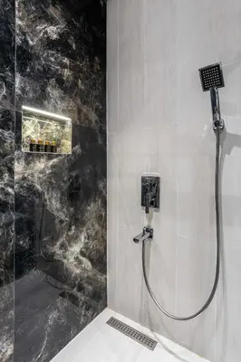 a shower in a bathroom with a glass wall at Marlon Hotel in Istanbul