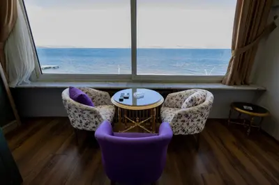 a room with chairs and a table and a large window at Karamürsel Mohti Otel Fitness Organizasyon in Karamusal
