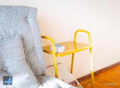 a room with a chair and a small table at Taksim FunHouse in Istanbul