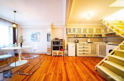 a kitchen with a table and a dining room at Taksim FunHouse in Istanbul