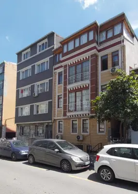 a group of cars parked in front of a building at Hane Apart in Istanbul