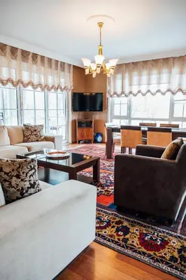 a living room with a couch and a table at Serbesler Botanik, No 1 Comfortable Villa in Sakarya