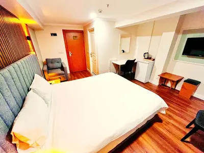 a bedroom with a large white bed in a room at Naila Hotel in Istanbul