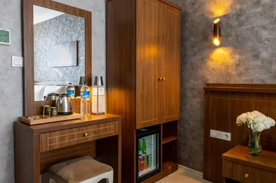 a hotel room with a vanity and a mirror at Diamond Beyazit Hotel in Istanbul