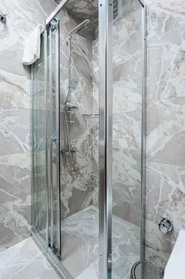 a shower with a glass door in a bathroom at Dream Park Hotel in Istanbul