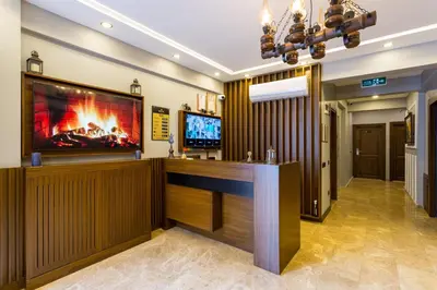 a lobby with a bar with a tv on the wall at Dream Park Hotel in Istanbul