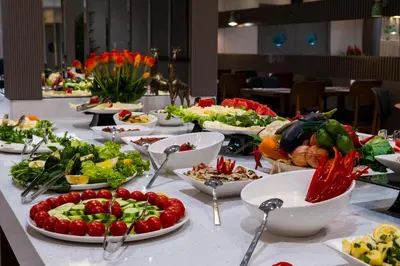 a table with many plates of food on it at Buke Hotel Bomonti in Istanbul