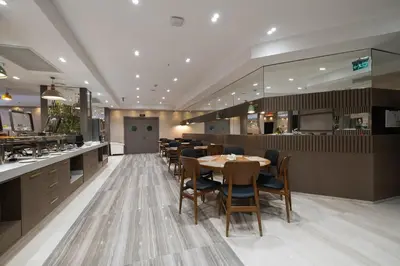 a restaurant with tables and chairs and a bar at Buke Hotel Bomonti in Istanbul