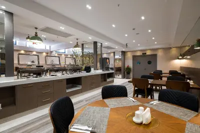 a dining room with a table and chairs at Buke Hotel Bomonti in Istanbul