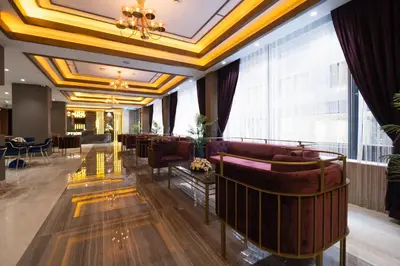 a lobby of a hotel with couches and a bar at Buke Hotel Bomonti in Istanbul