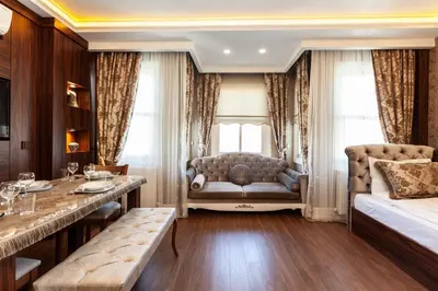 a living room with a couch and a table at Rose Apartments in Istanbul