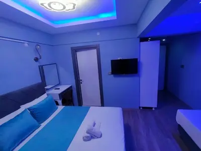 a room with a bed and a tv on the ceiling at Grand Bona Sera Hotel in Istanbul