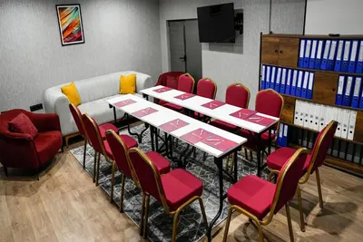 a room with tables and chairs and a couch at Ramada Encore by Wyndham Istanbul Arnavutkoy in Istanbul