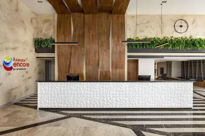 a lobby with a reception desk in a building at Ramada Encore by Wyndham Istanbul Arnavutkoy in Istanbul