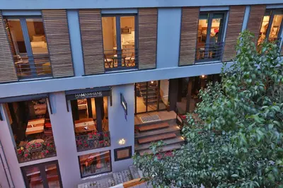 an apartment building with a staircase in front of it at Hammamhane Hotel in Istanbul