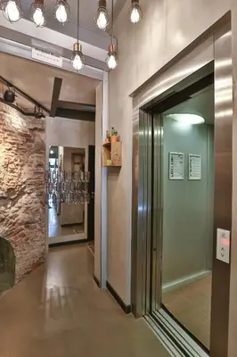 a hallway with a glass door in a building at Hammamhane Hotel in Istanbul