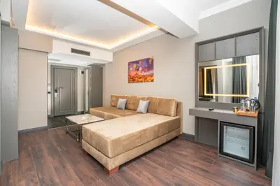 a living room with a couch and a tv at 216 Style Suite in Istanbul