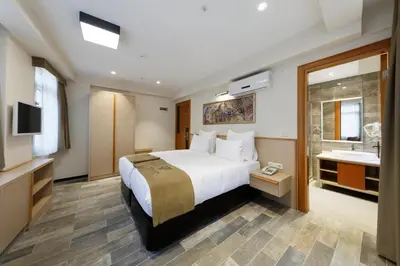 a hotel room with a bed and a tub and a sink at Nishant Hotel in Istanbul