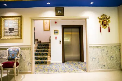a hallway with a door and stairs in a building at Edibe Sultan Hotel in Istanbul