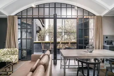 a living room with a table and a couch at RA Apartments in Istanbul