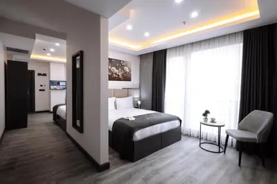 a hotel room with a bed and a chair at Meyzi Hotel in Istanbul
