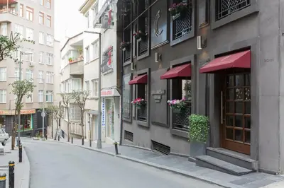 an empty street in front of a building at Carina Park Suites Nisantasi in Istanbul