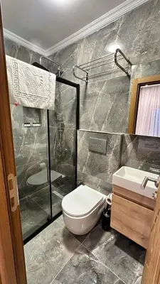 a bathroom with a toilet and a shower and a sink at Mamma Marya Hotel in Istanbul