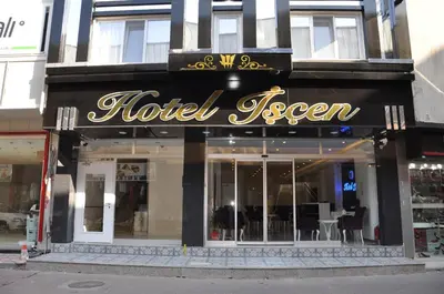 a hotel sign on the front of a store at Hotel Iscen in Mustafakemalpaşa