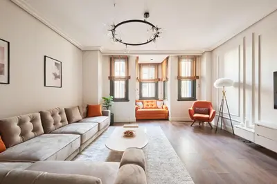 a living room with a couch and a table at Taksim Lagirio Residence in Istanbul