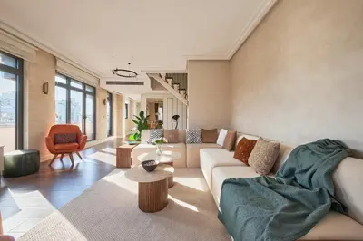 a living room with a couch and a table at Taksim Lagirio Residence in Istanbul