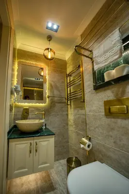 a bathroom with a sink and a mirror at Mahhsen Mansion Oldcity in Istanbul