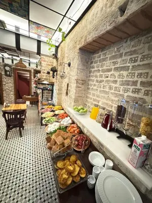 a buffet line with bread and other food on it at Veva Homes in Istanbul